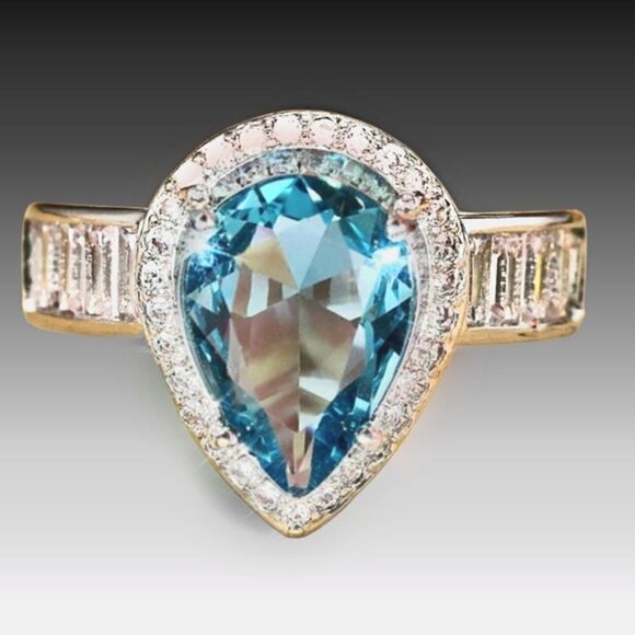 Pear Cut Blue Sapphire Flanked By White Baguette Diamonds on 925 Sterling Silver - Picture 2 of 8